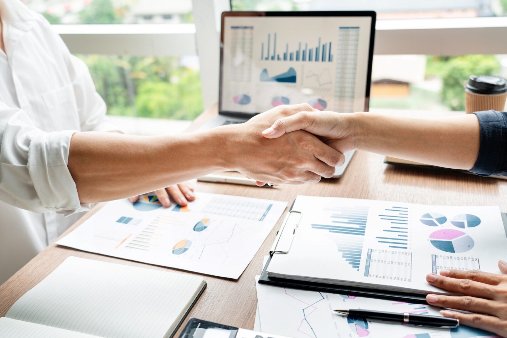 Taxpayer and attorney reviewing financial statements to calculate reasonable collection potential for an offer in compromise