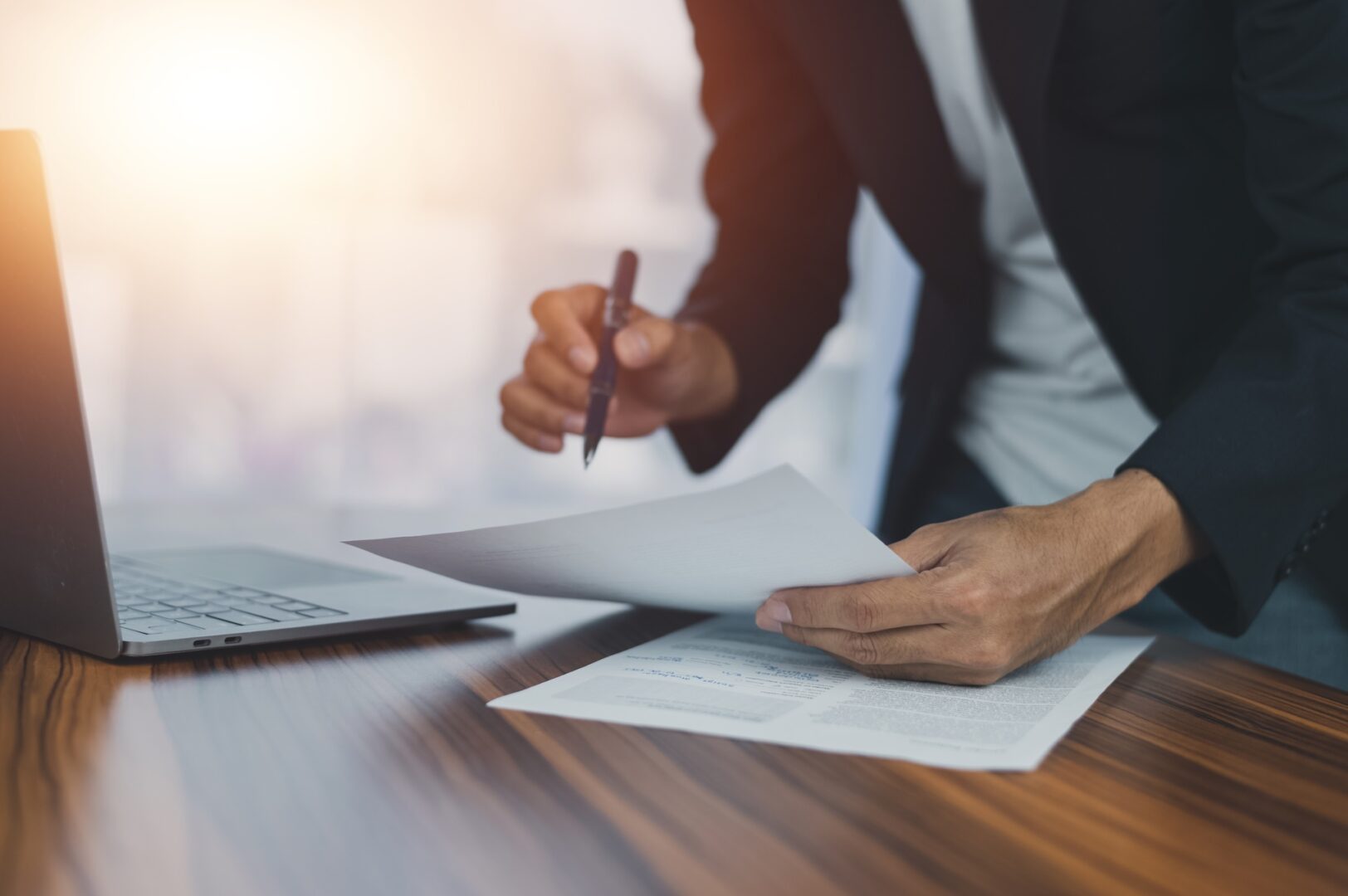 Taxpayer reviewing a Notice of Federal Tax Lien and levy paperwork with a tax attorney Taxpayer reviewing a Notice of Federal Tax Lien and levy paperwork with a tax attorney