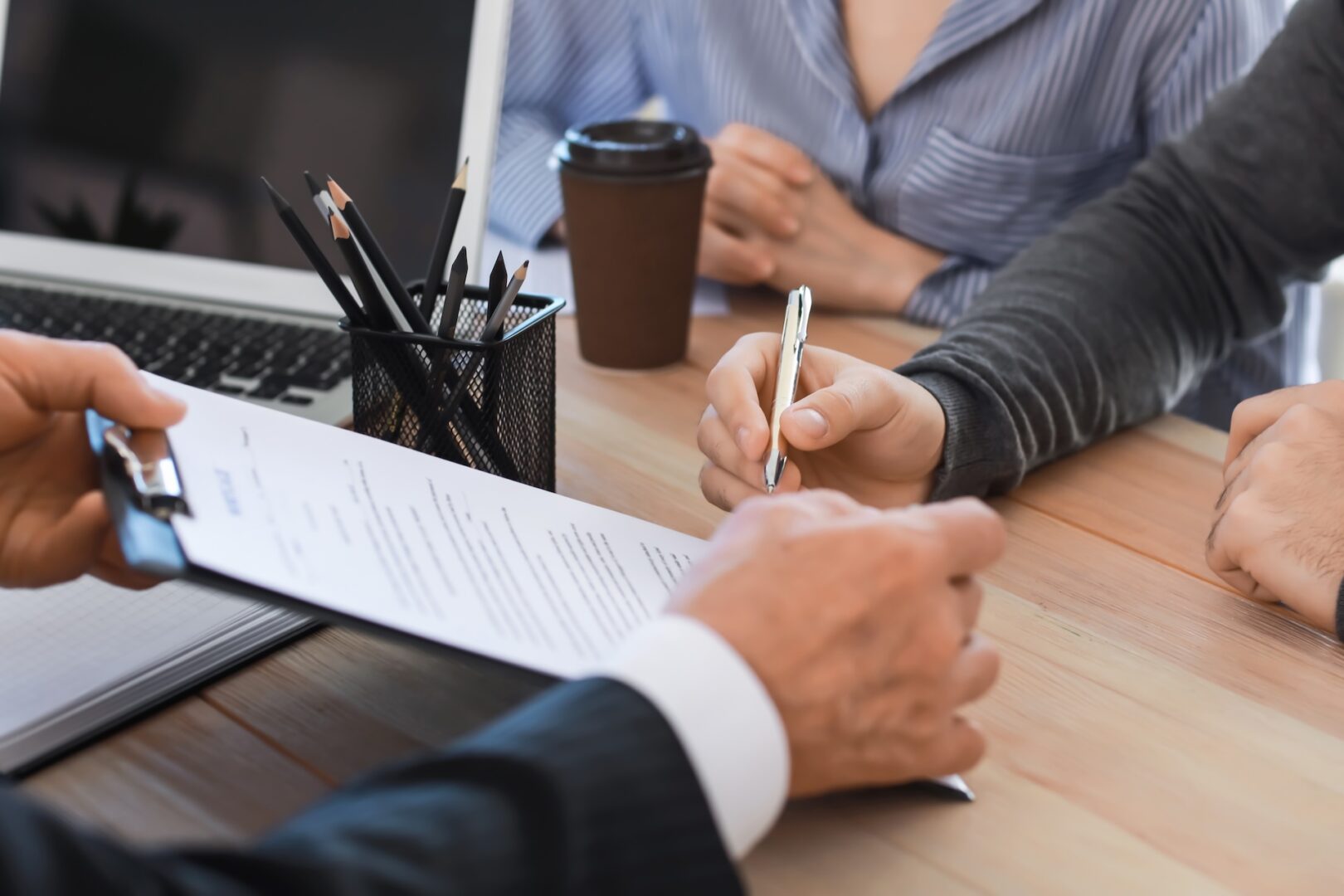 Business owner and attorney reviewing an operating agreement at a desk
