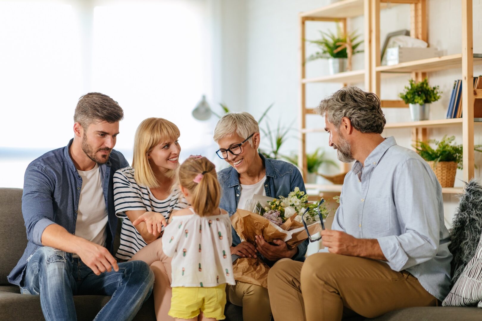 Multigenerational California family discussing an inherited home and Proposition 19 reassessment