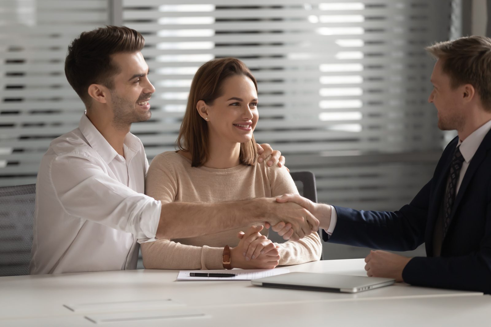 Family reviewing estate planning documents and trust structures with a tax attorney