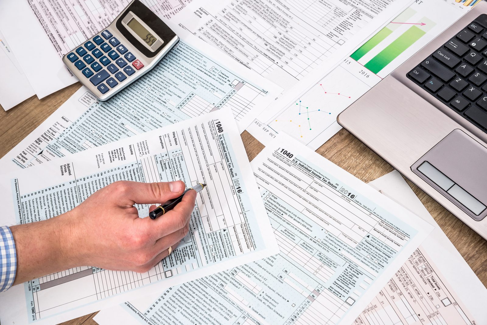 Business owner comparing federal and state tax returns for OBBBA conformity differences Business owner comparing federal and state tax returns for OBBBA conformity differences
