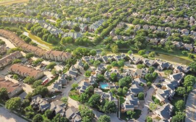 Investor reviewing Opportunity Zone fund documents and deferred gain deadline with a tax attorney